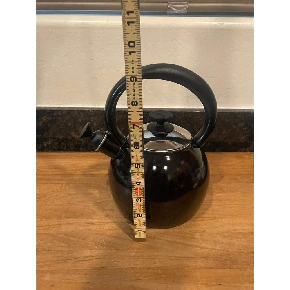 Copco black enameled tea pot with whistler